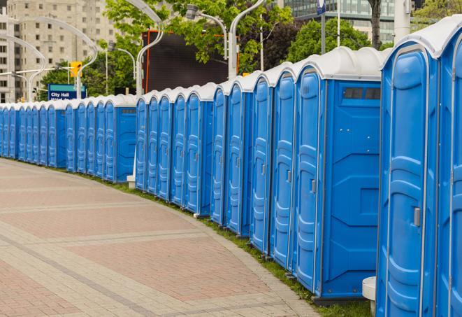 portable restrooms stationed outside of a high-profile event, with attendants available for assistance in Alameda, CA